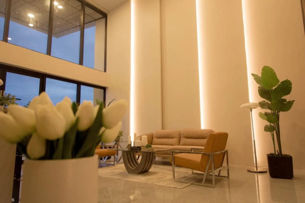 Modern lounge with sofa and armchairs in Twin Hearts Residences, Roxas City